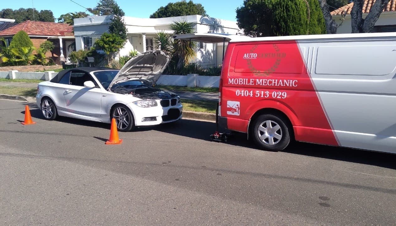 Auto Certified Mobile Mechanic servicing a BMW on location
